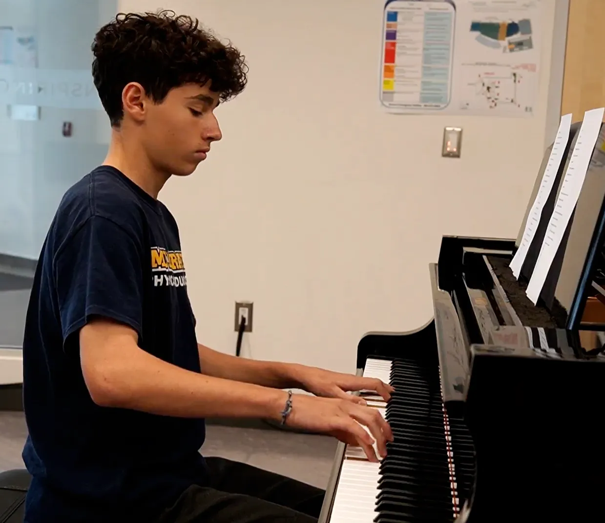 Ignacio Revello playing the piano at an elderly home